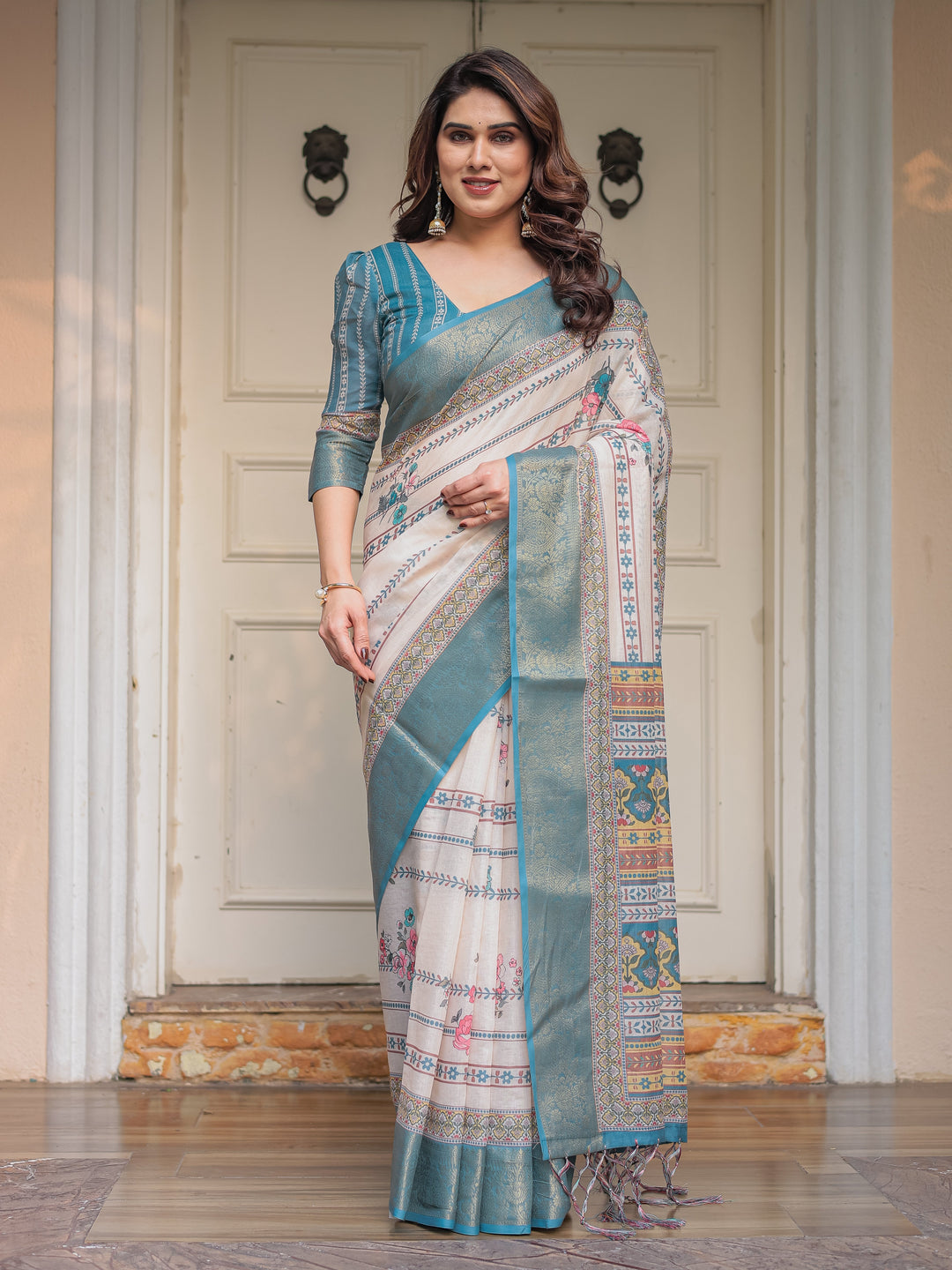 Off-White & Aqua Teal Traditional Printed Saree with Rich Zari Border & Tassels – Elegant Ethnic Festive Wear