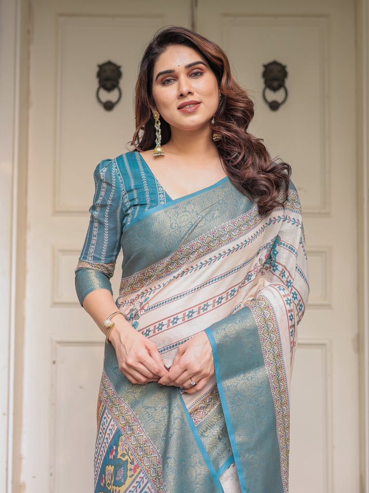 Off-White & Aqua Teal Traditional Printed Saree with Rich Zari Border & Tassels – Elegant Ethnic Festive Wear
