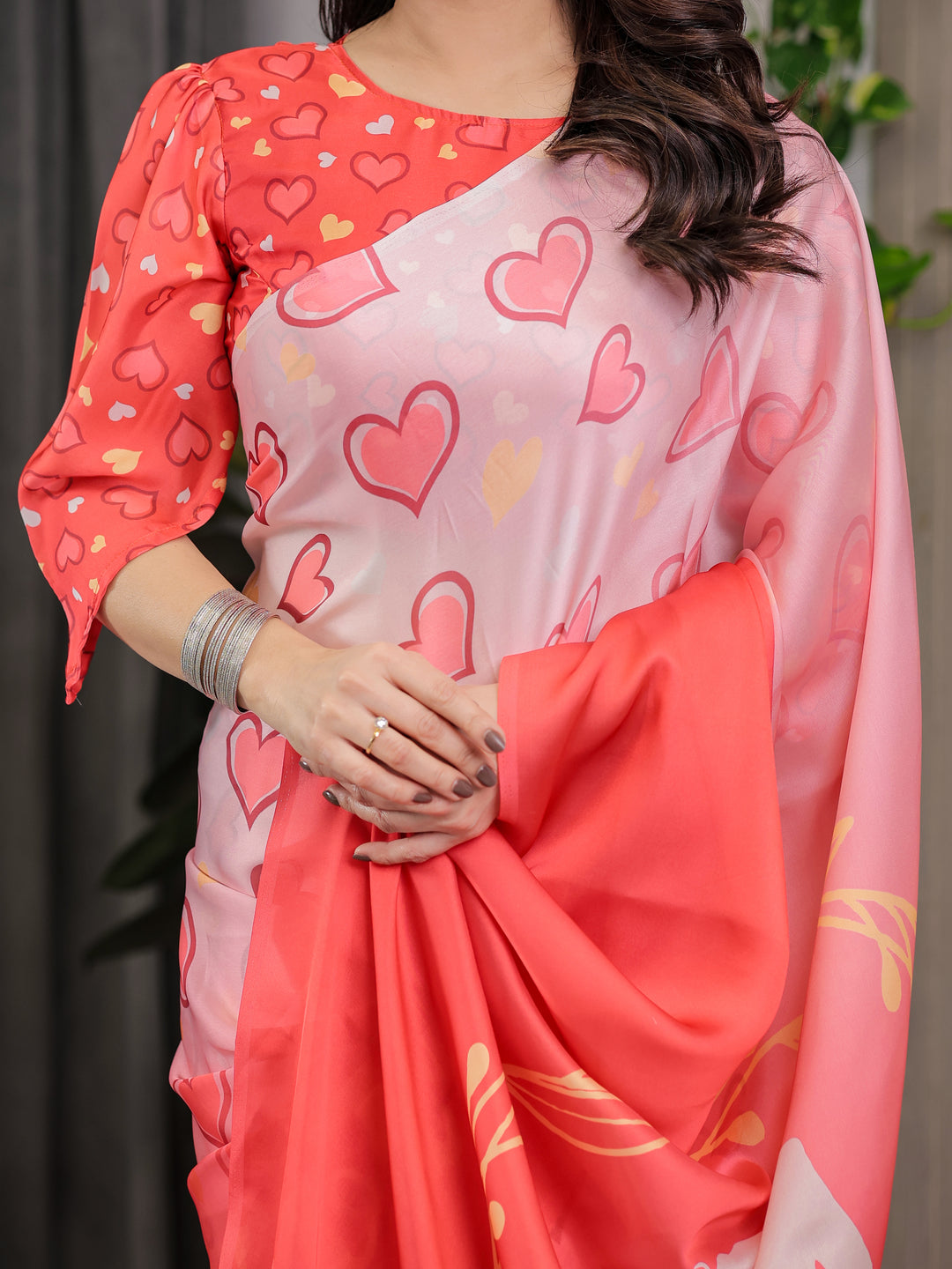 Coral Red & Blush Pink Heart Printed Satin Georgette Saree with Romantic Couple Pallu and Attached Heart Print Blouse – 5.5 Meter Designer Saree for Valentine’s Day & Anniversary Wear