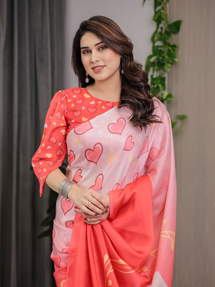 Coral Red & Blush Pink Heart Printed Satin Georgette Saree with Romantic Couple Pallu and Attached Heart Print Blouse – 5.5 Meter Designer Saree for Valentine’s Day & Anniversary Wear