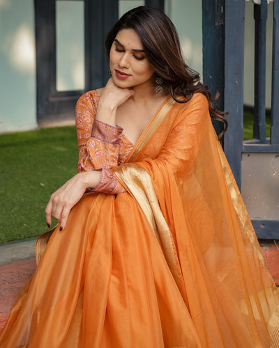 Sunset Orange Plain Chiffon Saree with Gold Zari Border, Floral Embroidered Blouse & Tassel Detailing