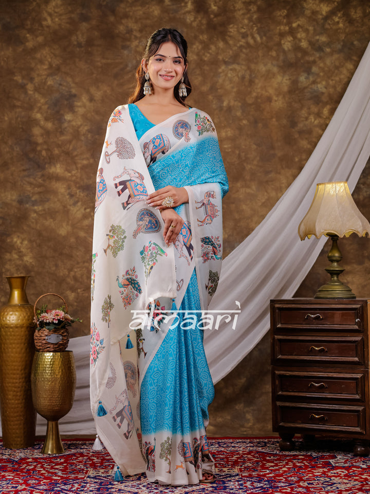 Vantara Turquoise Blue Satin Chiffon Printed Saree with Elephant & Peacock Heritage Print, Designer Tassel Pallu & Matching Blouse Piece