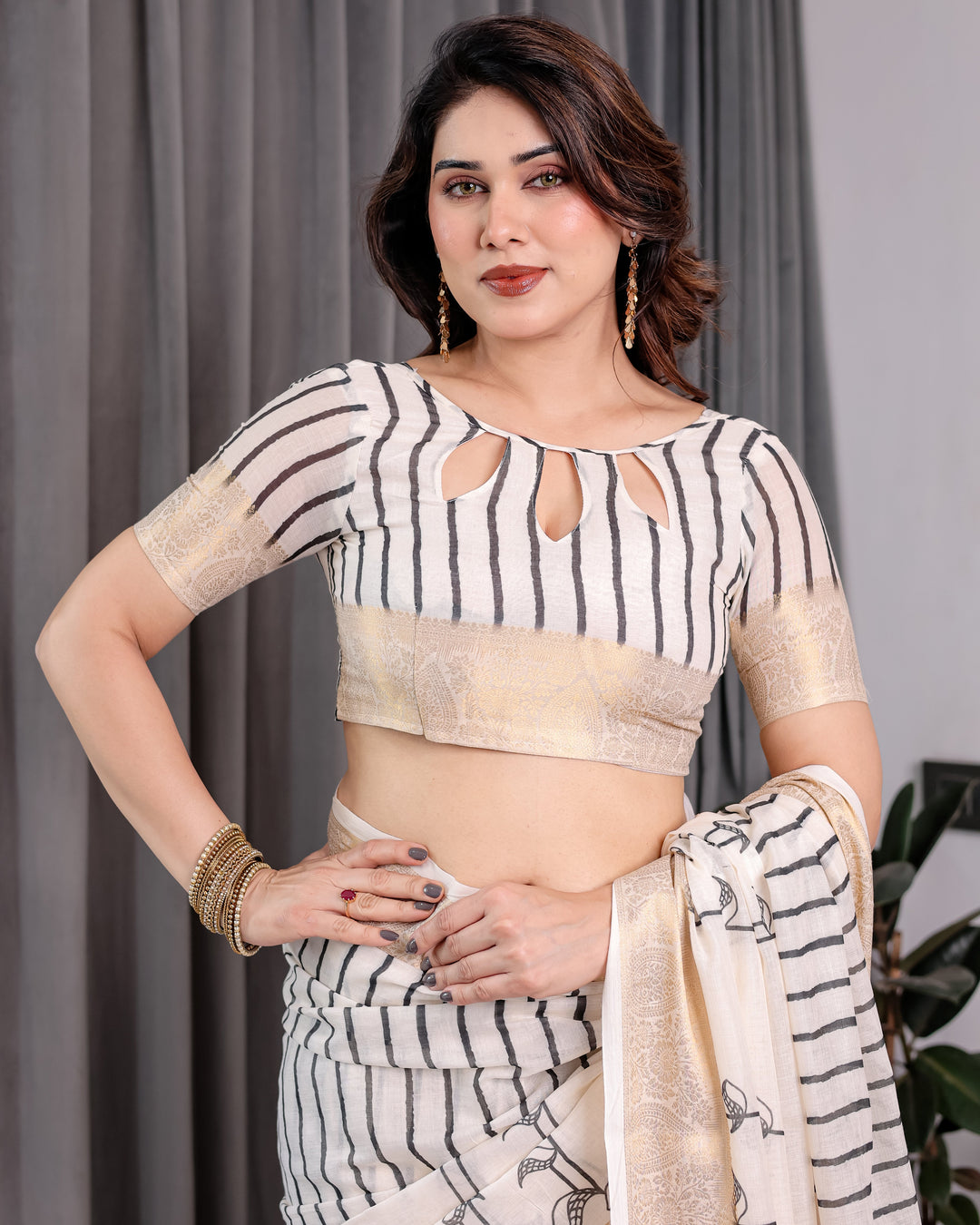 Off-White Handloom Linen Saree with Black Vertical Stripes Tribal Motifs Golden Zari Border Tassel Pallu Attached Blouse Saree