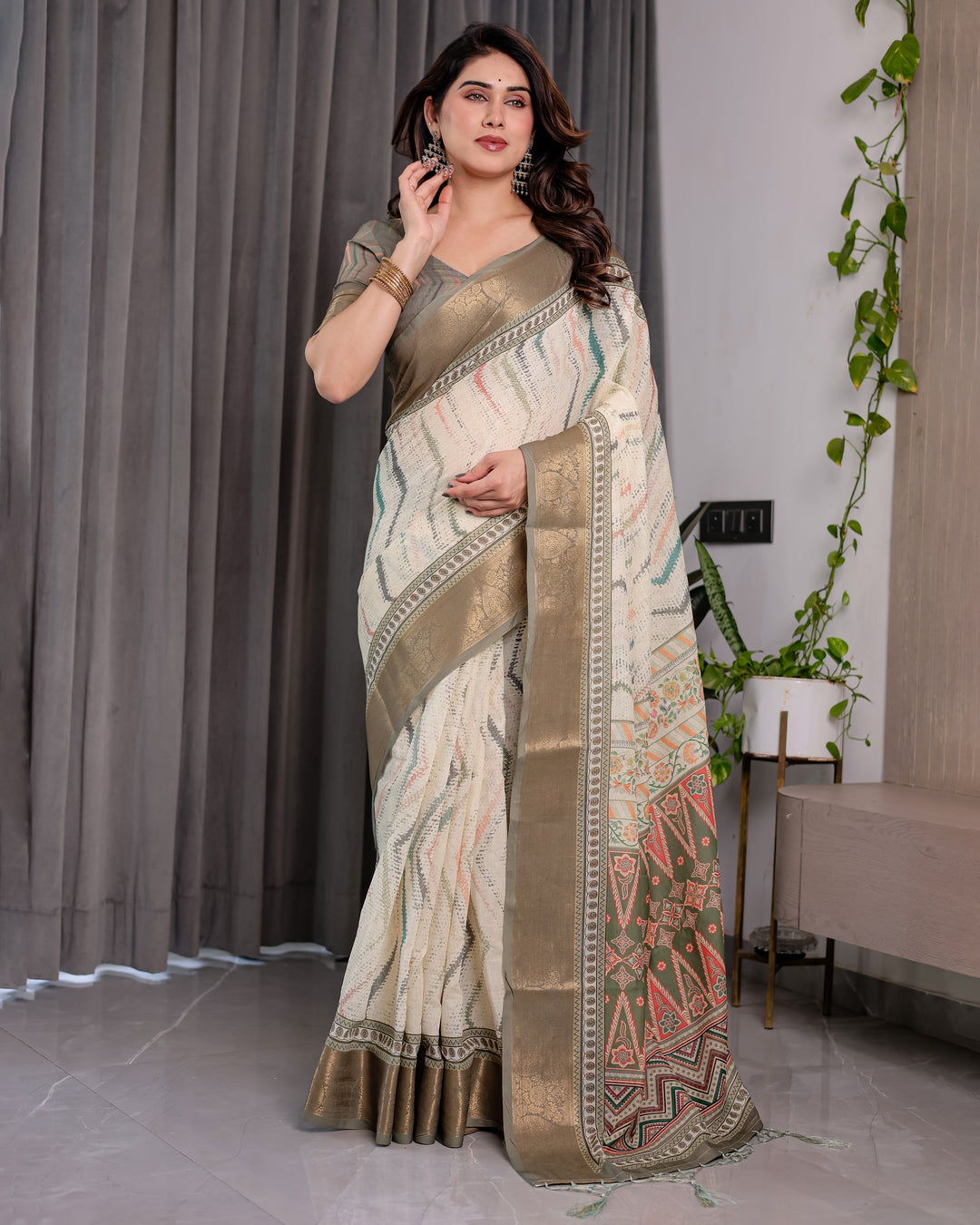 Elegant Cream & Gold Woven Ikat Silk Saree with Designer Border With Tassles