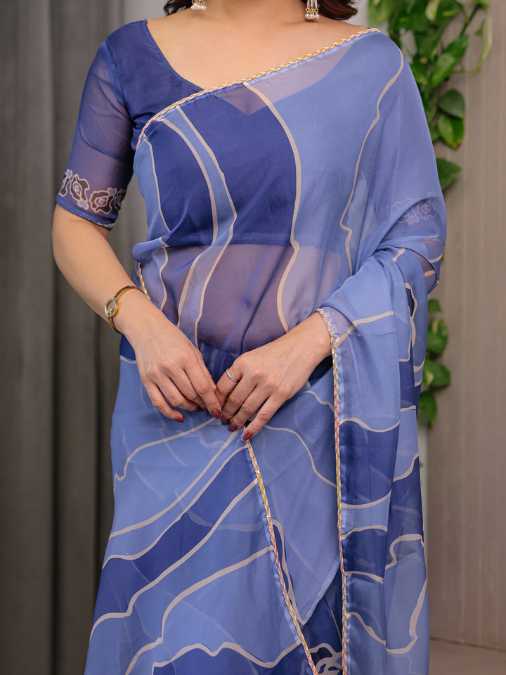 Elegant Steel Blue Printed Organza Saree with Abstract Wave Motifs & Multicolour Lace Border | Designer Lightweight Organza Saree with Attached Blouse Piece | Contemporary Festive Wear Saree