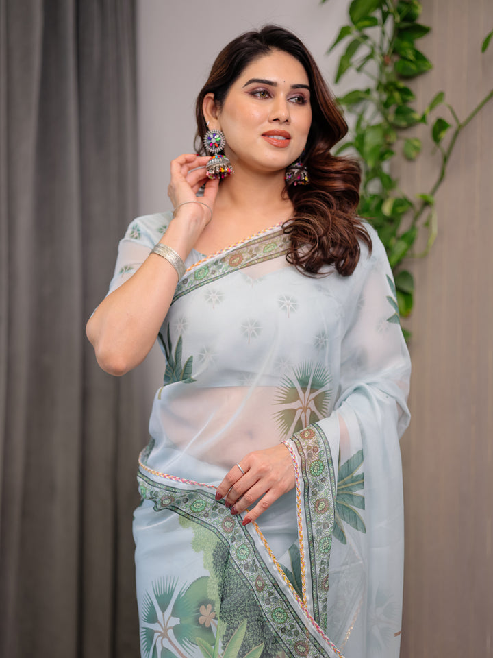 Pastel Mint Green Printed Organza Saree with Tropical Leaf Motifs | Designer Lightweight Sheer Organza Saree with Attached Blouse Piece | Elegant Festive & Day Party Saree