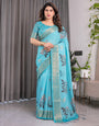 Turquoise Blue Handloom Linen Saree with Floral Digital Print & Golden Zari Border | Tassel Detailing | Attached Blouse | 5.5m Saree + 0.8m Blouse