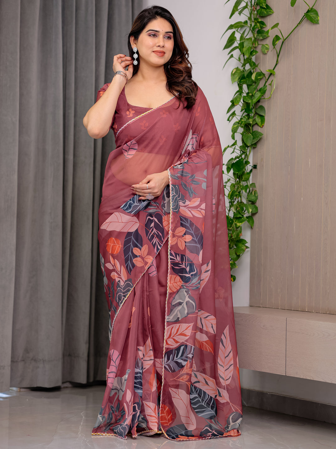 Rust Wine Printed Organza Saree with Tropical Leaf Border | Designer Lightweight Sheer Organza Saree with Botanical Prints & Attached Blouse Piece | Elegant Festive & Party Wear Saree