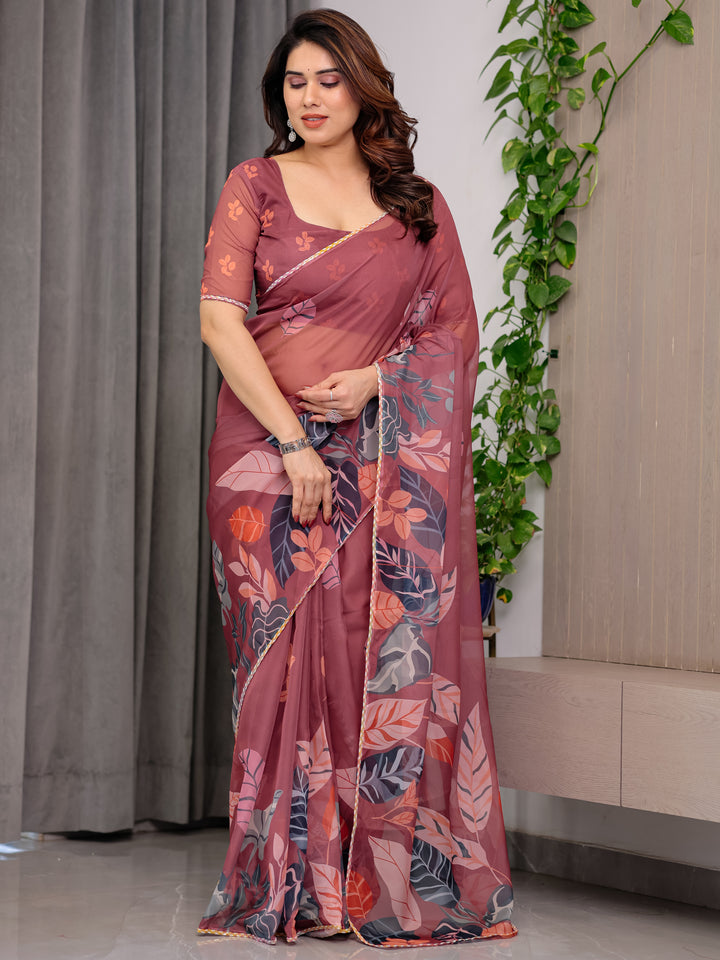 Rust Wine Printed Organza Saree with Tropical Leaf Border | Designer Lightweight Sheer Organza Saree with Botanical Prints & Attached Blouse Piece | Elegant Festive & Party Wear Saree