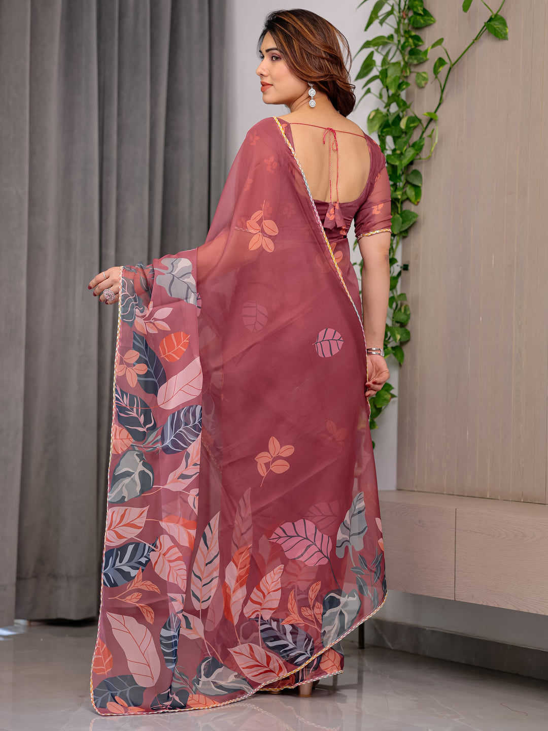 Rust Wine Printed Organza Saree with Tropical Leaf Border | Designer Lightweight Sheer Organza Saree with Botanical Prints & Attached Blouse Piece | Elegant Festive & Party Wear Saree