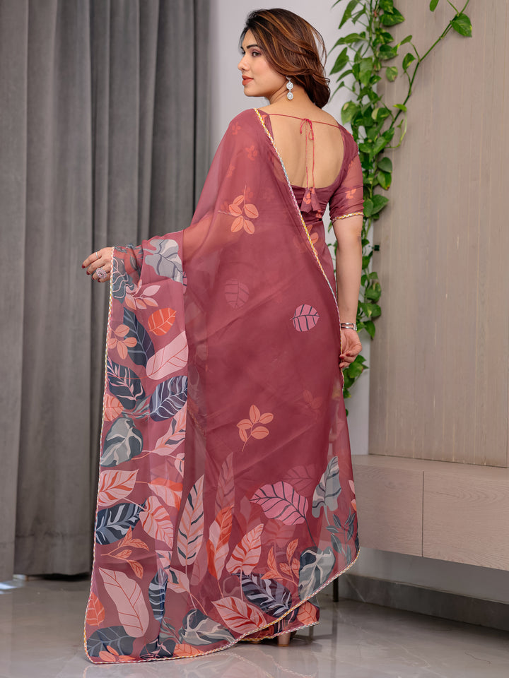 Rust Wine Printed Organza Saree with Tropical Leaf Border | Designer Lightweight Sheer Organza Saree with Botanical Prints & Attached Blouse Piece | Elegant Festive & Party Wear Saree