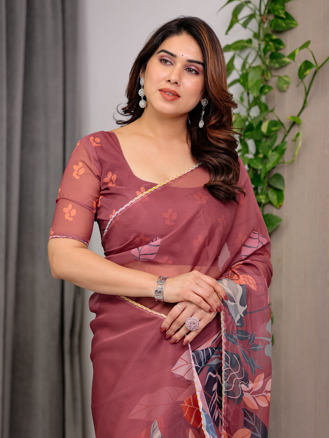 Rust Wine Printed Organza Saree with Tropical Leaf Border | Designer Lightweight Sheer Organza Saree with Botanical Prints & Attached Blouse Piece | Elegant Festive & Party Wear Saree