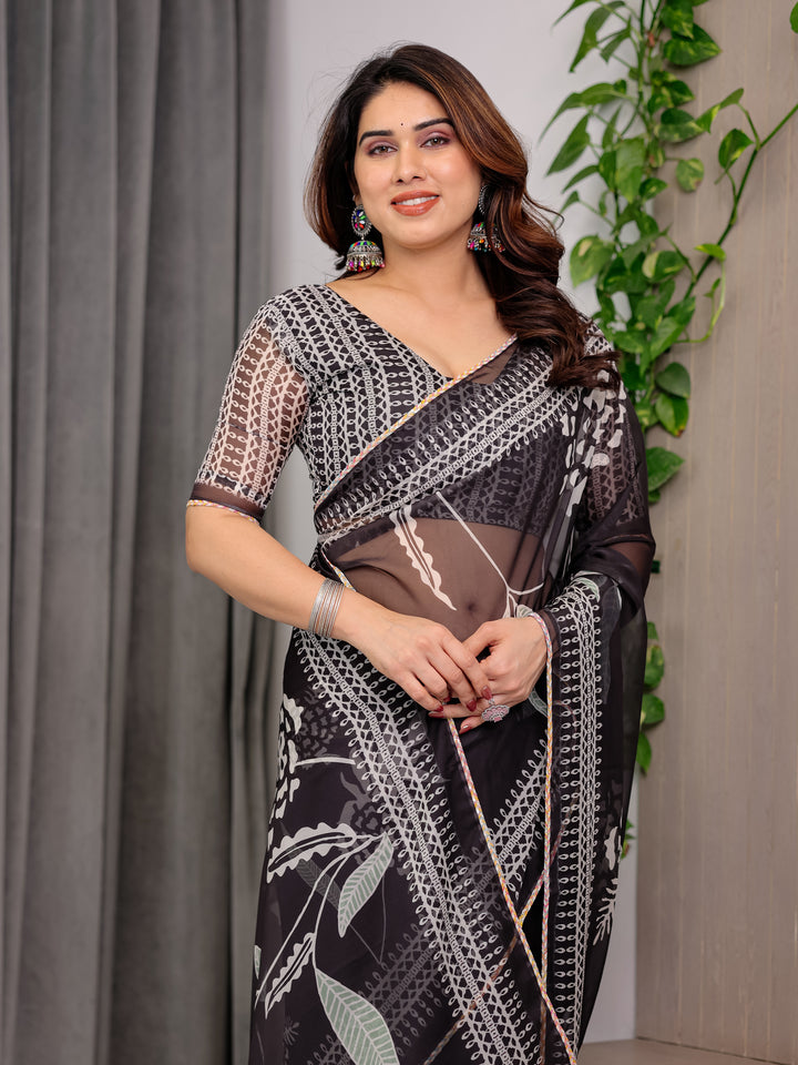 Elegant Black Floral Printed Organza Saree with Intricate Ethnic Border & Multicolour Lace Edges | Lightweight Designer Organza Saree with Attached Blouse Piece | Festive & Party Wear Saree