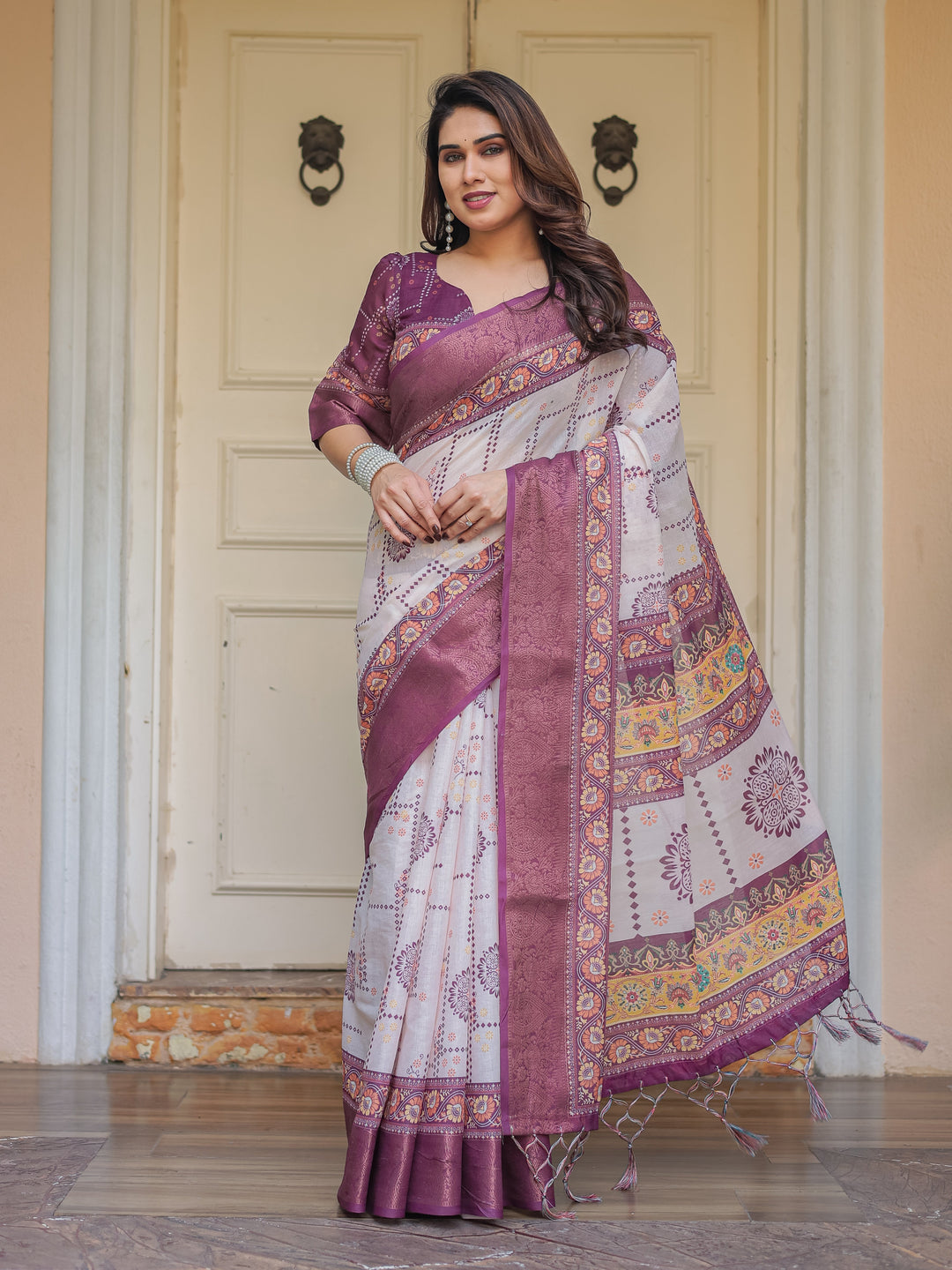 Wine Purple Handloom Cotton Printed Saree with Floral Panel Pallu, Ornamental Border & Tassels – Festive Ethnic Wear