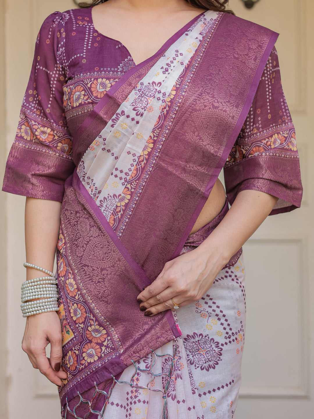 Wine Purple Handloom Cotton Printed Saree with Floral Panel Pallu, Ornamental Border & Tassels – Festive Ethnic Wear