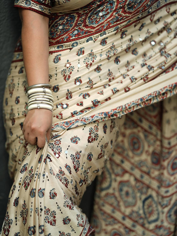 Ivory Modal Silk Ajrakh Printed Saree with Traditional Floral Motifs, Heritage Border & Tassel Detailing