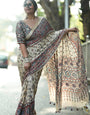 Ivory Modal Silk Ajrakh Printed Saree with Traditional Floral Motifs, Heritage Border & Tassel Detailing