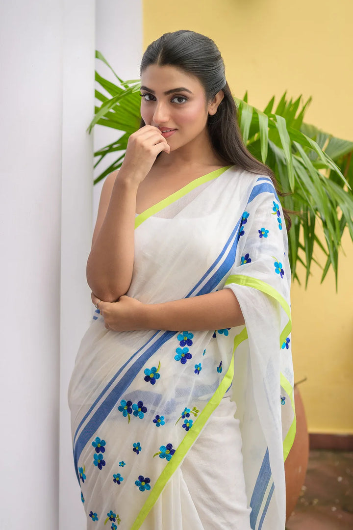 Ivory Mul Cotton Saree with Blue Floral Embroidery, Contrast Border & Tasselled Pallu
