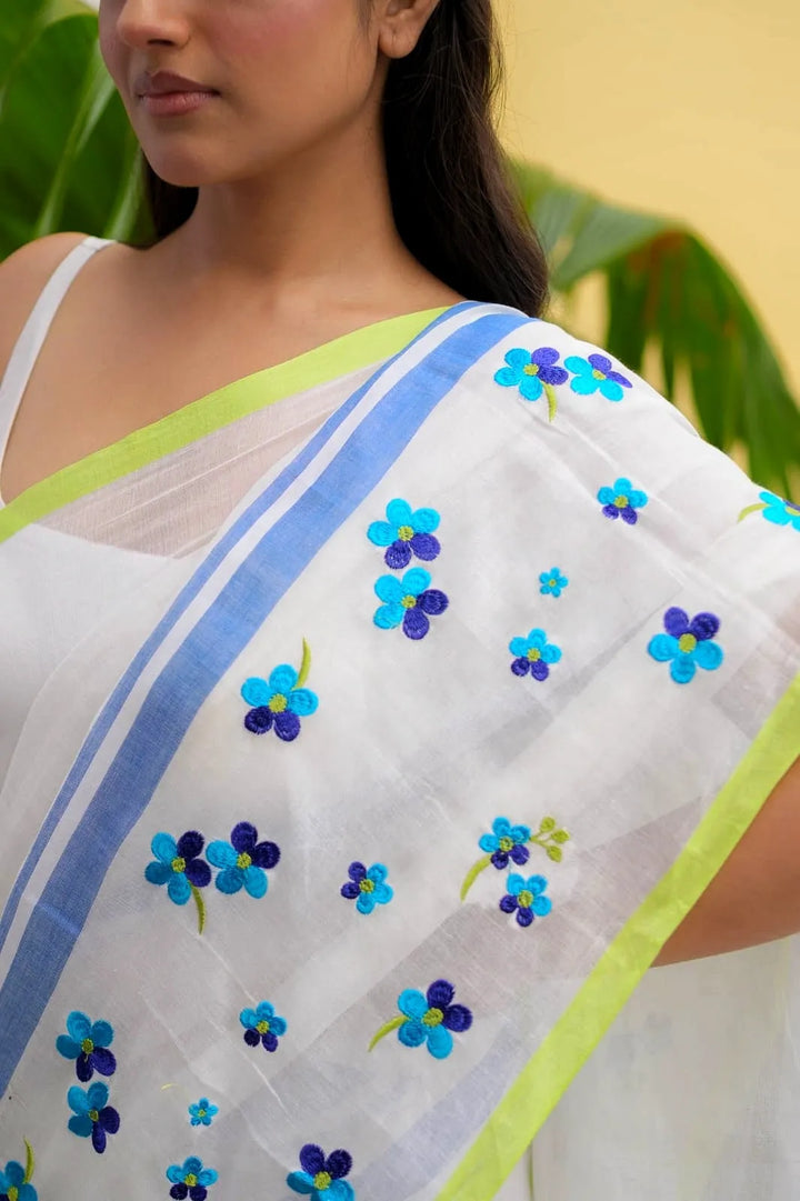 Ivory Mul Cotton Saree with Blue Floral Embroidery, Contrast Border & Tasselled Pallu