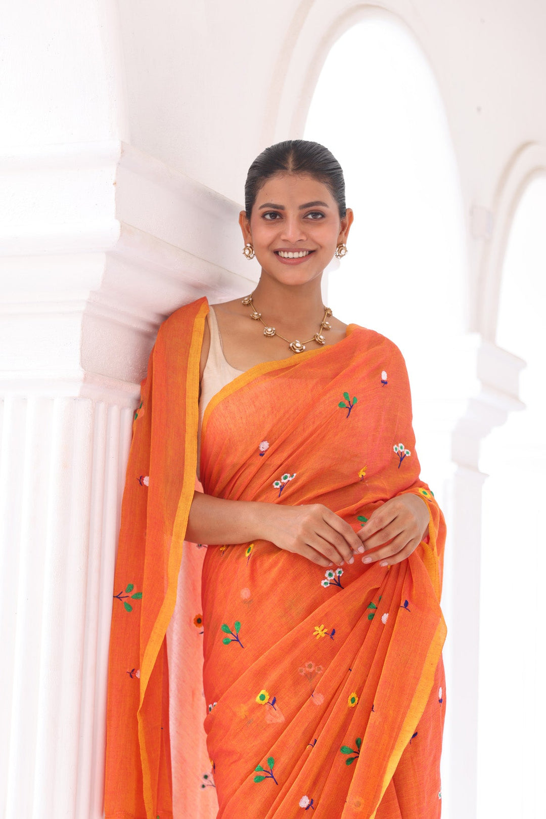 Rust Orange Mul Cotton Saree with Multicolour Floral Motifs & Elegant Woven Border
