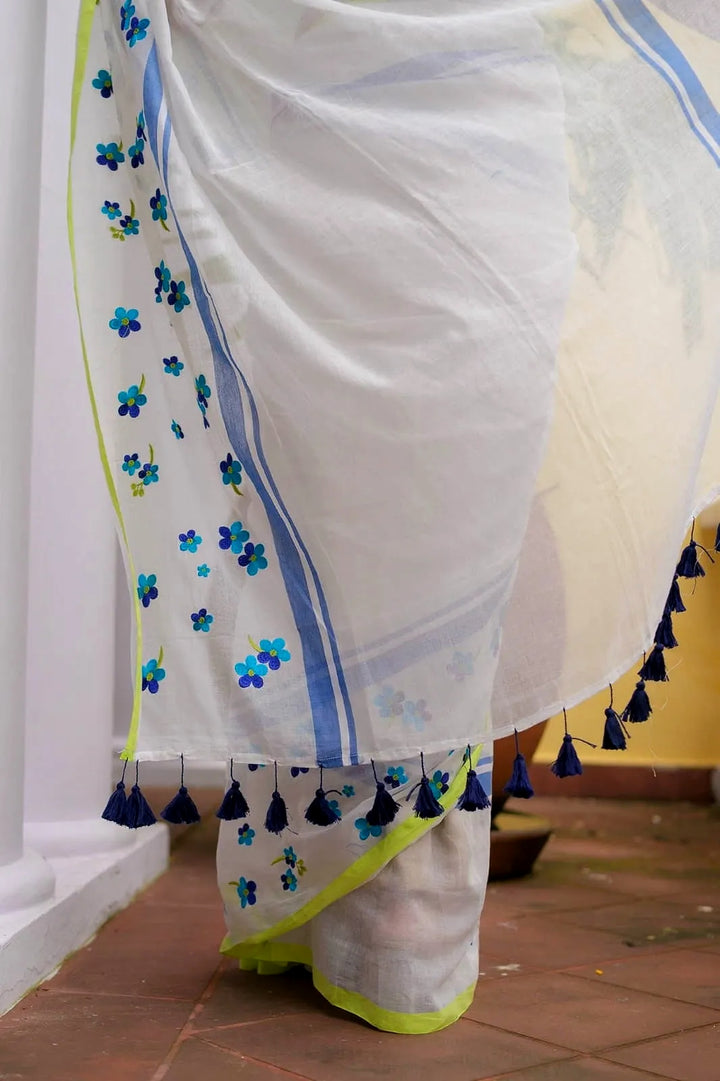 Ivory Mul Cotton Saree with Blue Floral Embroidery, Contrast Border & Tasselled Pallu, Comes With Attached Blouse Piece